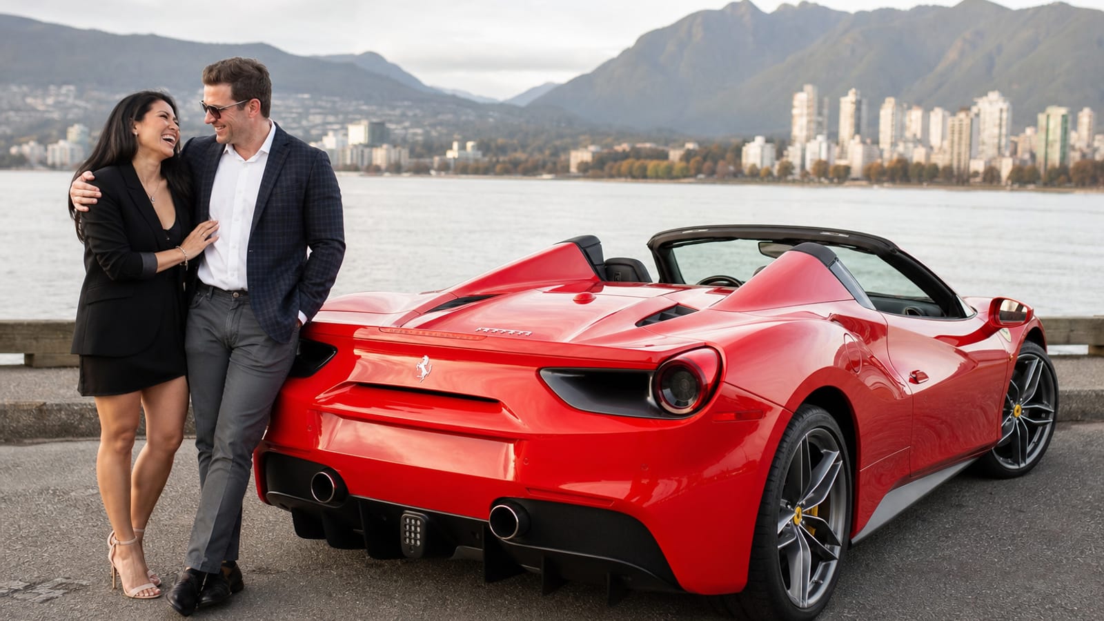 Happy member accepting RoLux Club keys next to a luxury sedan at dusk